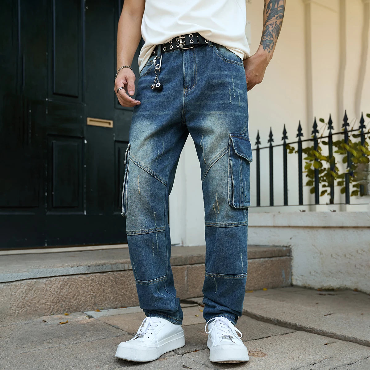 Men’s trendy streetwear: straight-leg, non-stretch, multi-pocket, dark-colored denim jeans.