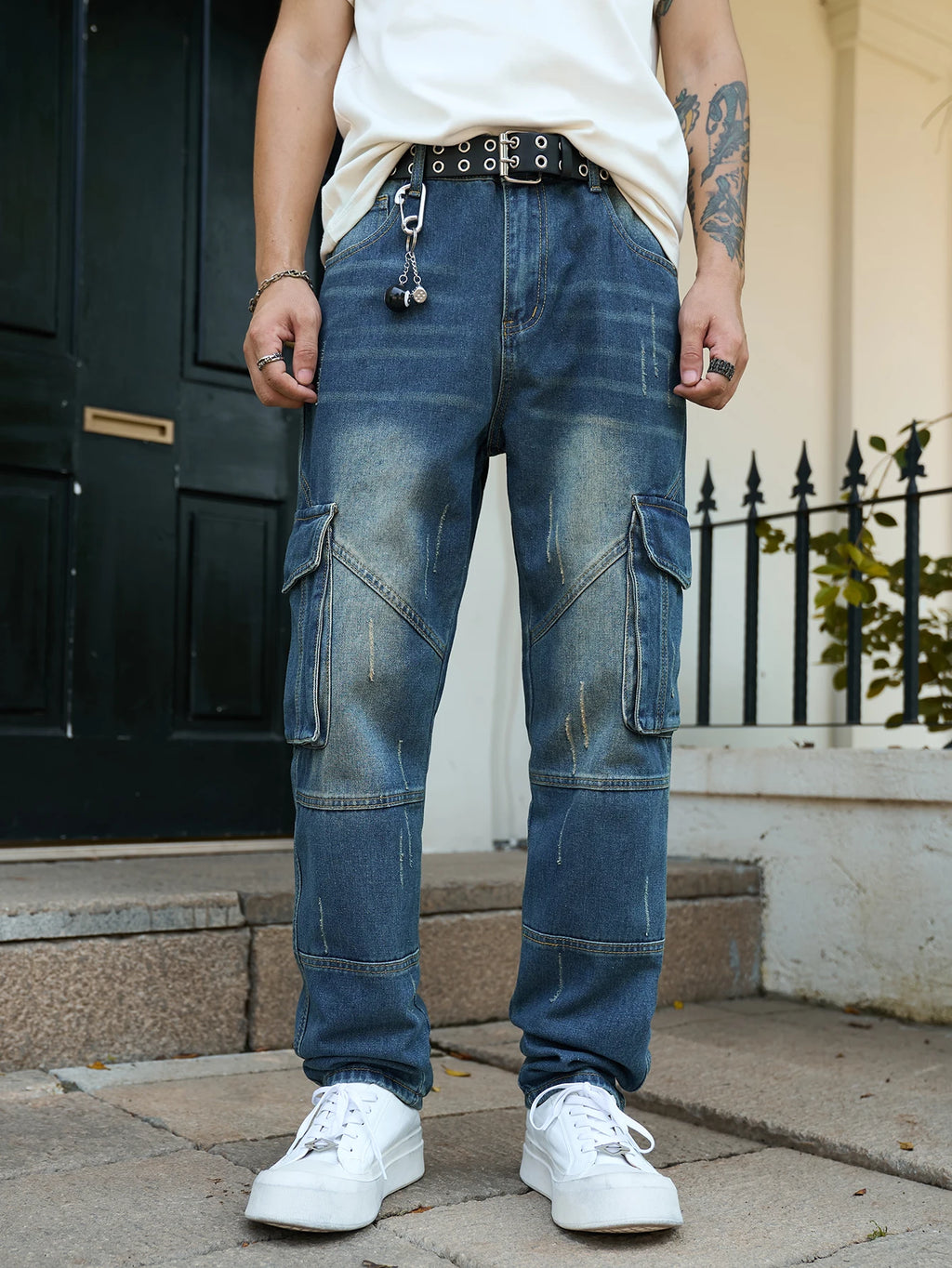 Men’s trendy streetwear: straight-leg, non-stretch, multi-pocket, dark-colored denim jeans.