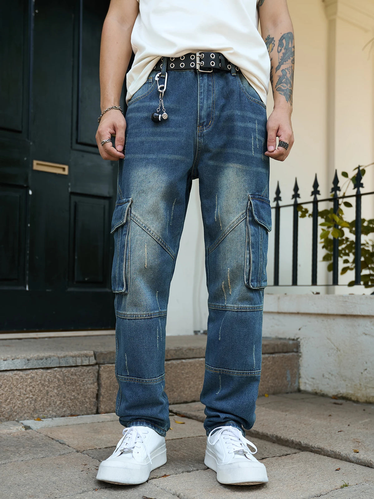 Men’s trendy streetwear: straight-leg, non-stretch, multi-pocket, dark-colored denim jeans.