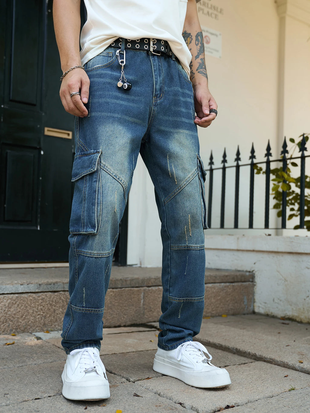 Men’s trendy streetwear: straight-leg, non-stretch, multi-pocket, dark-colored denim jeans.